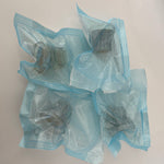 Four transparent microneedling replacement cartridges displayed together with different rectangular needle head configurations.